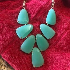 Kendra Scott gold Harlow statement necklace in chalcedony green.